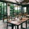 Outdoor dining area at a local restaurant surrounded by vibrant green trees