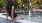 Woman lounging by the pool with her feet submerged and enjoying the view