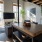 Generous-sized resident clubhouse with lots of different seating sections and flooded with natural light