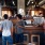 Friends gathered around a local bar area chatting and enjoying drinks