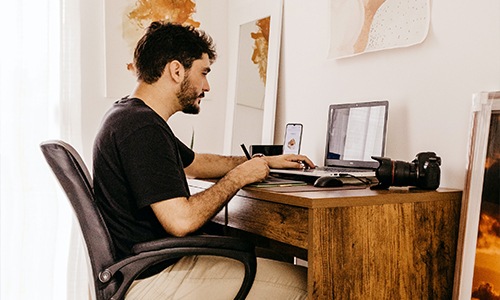 Man working on his computer from home