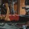 Woman laying on workout bench doing chest presses with dumbbells